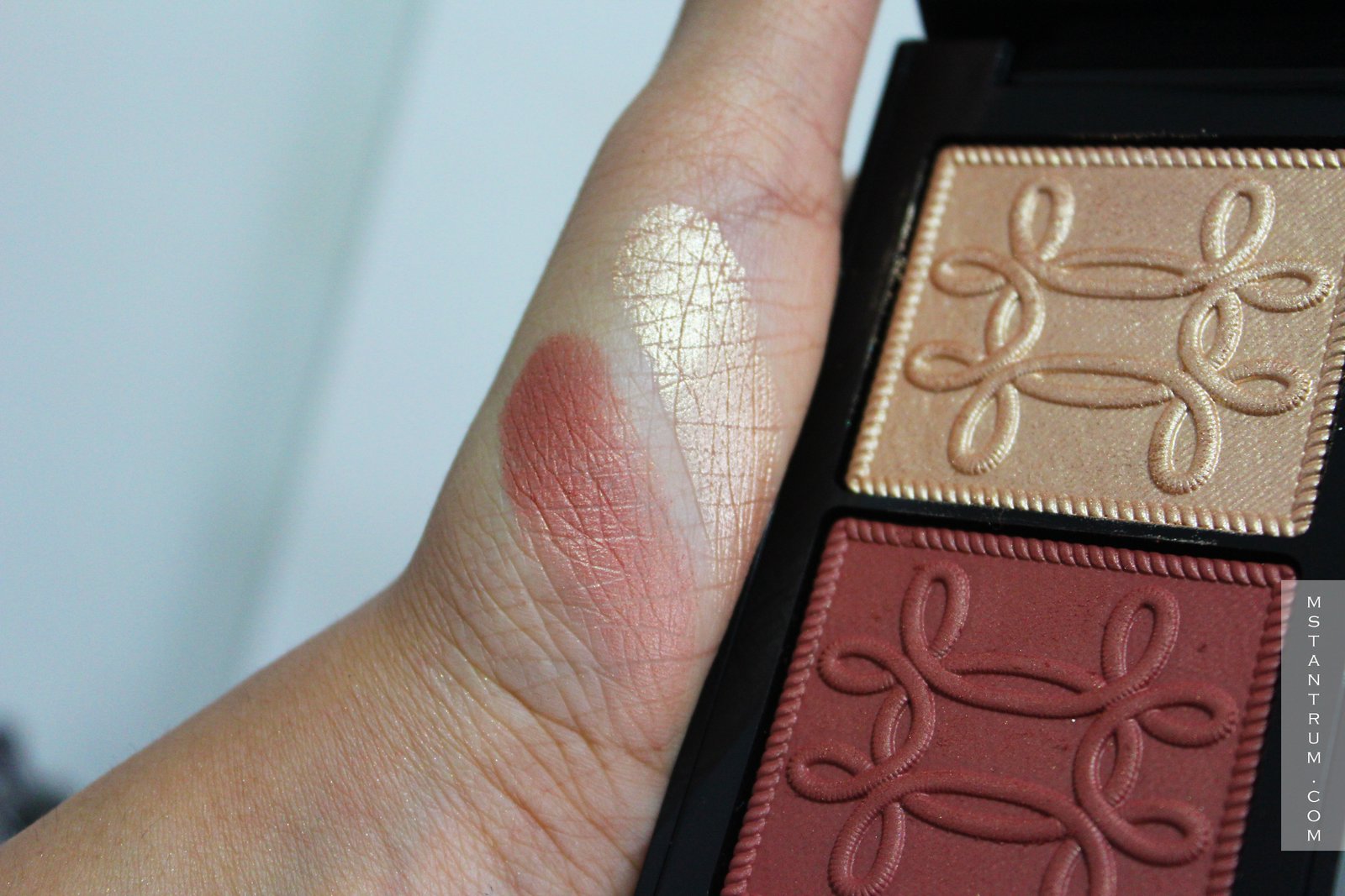 Swatches of Mac Nutcracker Sweet Copper face compact